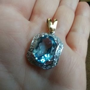Blue topaz gold encrusted pendant